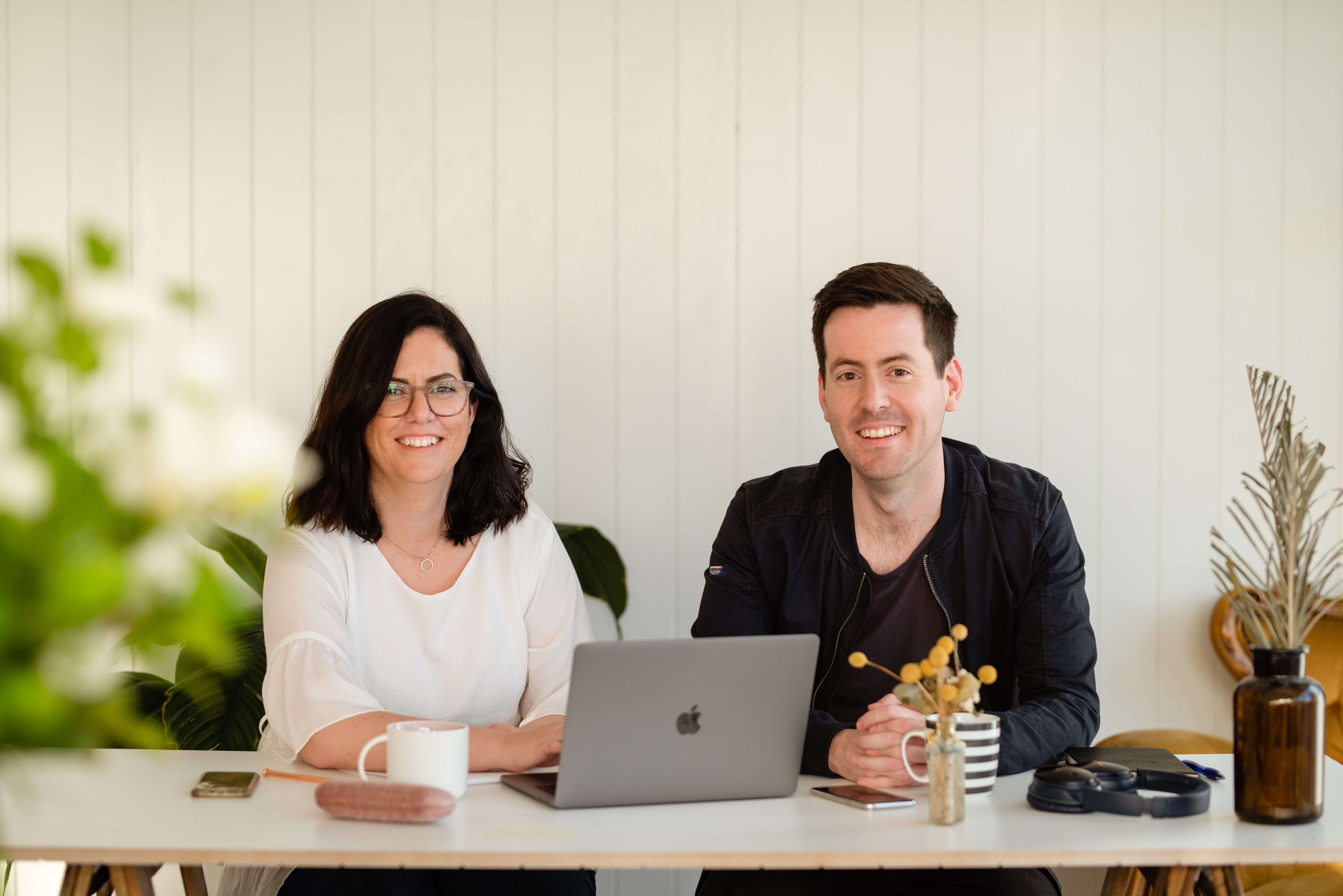 Man and woman on a Macbook